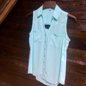 Light blue sleeveless top.